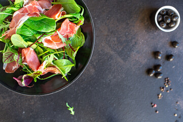 salad meat jamon prosciutto green leaves mix lettuce olives vegetables snack healthy meal top view copy space for text food background rustic image keto or paleo diet