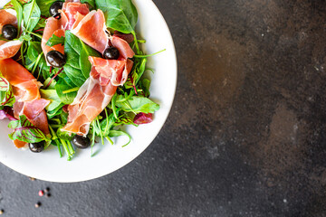 salad meat jamon prosciutto green leaves mix lettuce olives vegetables snack healthy meal top view copy space for text food background rustic image keto or paleo diet