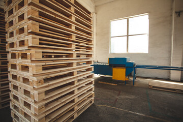 The pallets are located in the middle of the warehouse