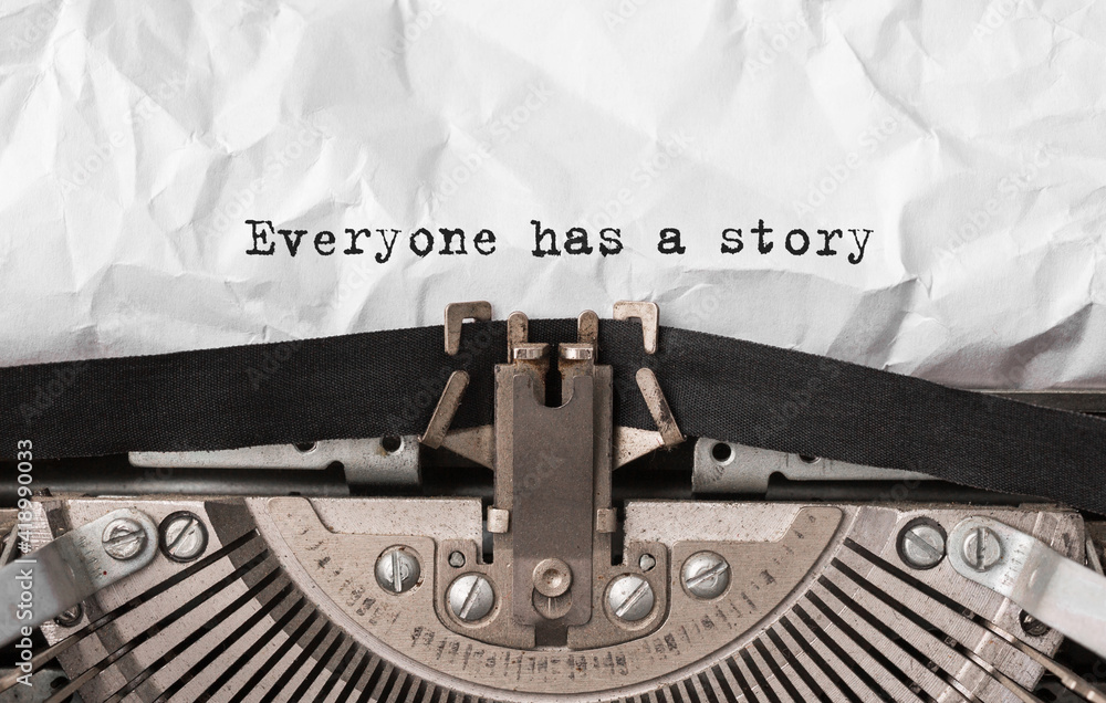 Poster text everyone has a story typed on retro typewriter