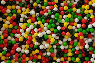 Fototapeta na wymiar Assorted gum balls close up. Pile of colorful edible balls close up. Tasty treats for kids.