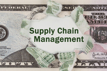 The dollar is torn in the center. In the center it is written - Supply Chain Management