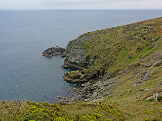 Cliffs and beach along rock coast of howth, ireland