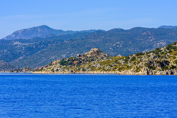 Fototapeta premium Ancient village Simena at shore of Mediterranean Sea at the Kekova area. Antalya province, Turkey