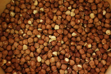 Ripe hazel nuts background. Pile of organic brown nuts close up. Food concept.