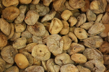 Dried figs background. Organic fruits at farmers market. Healthy food concept.