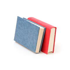 Stack of books in colour covers with white sheets isolated on a white background