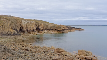 Cliffs and beach along rock coast of howth, ireland