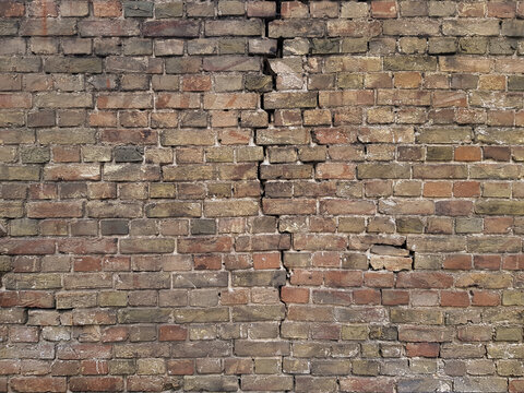 fragment of old brick wall of zania with crack, texture, pattern or wallpaper
