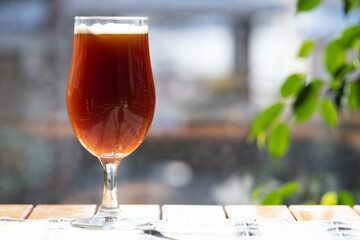 A delicious glass of home brewed craft beer on a table