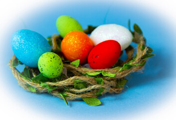 Easter eggs in nest , blue Easter background