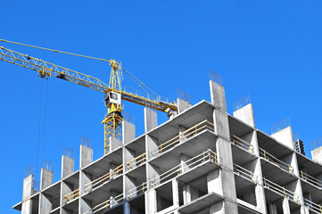 Crane and highrise construction site