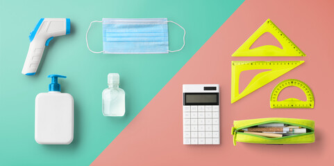Flat lay top view of face mask and school supplies, back to school and coronavirus concept.