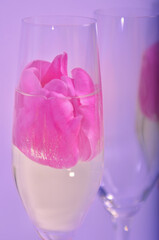 glasses with champagne and roses