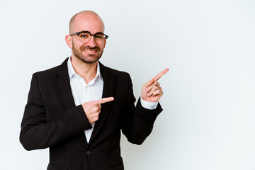 Young business caucasian bald man isolated on white background excited pointing with forefingers away.