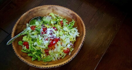 Tossed salad with Feta Cheese, Top View on a Rustic Background; Mediterranean Food, Healthy Food Choices, Diets