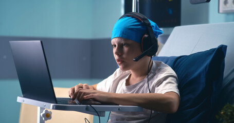 Little gamer winning videogame in hospital ward