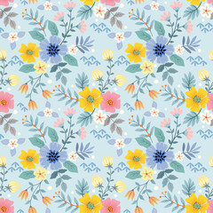 Colorful flowers on a light blue color seamless pattern for fabric textile background.