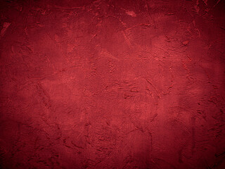 Beautiful decorative Venetian plaster in red. Plastered wall texture for backgrounds