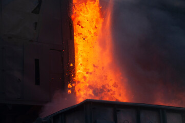 coke and chemicals plant. Unloading hot coke from a by-product coke battery. Hot coke is loaded onto a wagon.