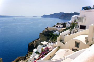Cyclades architecture hotels houses over the caldera in oia santorini greek islands, greece, mediterranean sea view with mountains