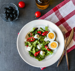 fresh mixed salad with napkin and black background