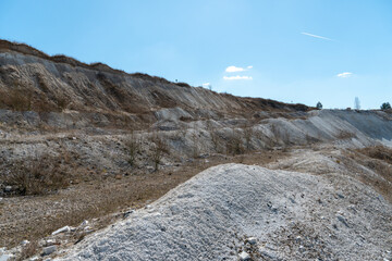 Large sand pit and lake. A flooded old abandoned quarry complex. Extraction of sand and stone for industrial applications.
