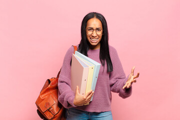 young black woman looking angry, annoyed and frustrated screaming wtf or what’s wrong with you....