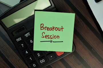 Breakout Session write on sticky notes isolated on Wooden Table.