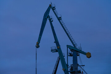 Crane on blue sky background