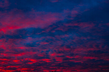 Beautiful orange sunset on the background of the city