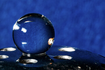 the crystal ball on inox steel in blue background