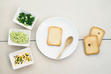 Avocado toasts on bread. Vegetarian food. Plant-based diet. Clean eating. Top view.