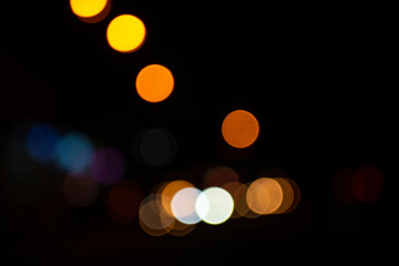Bright round lights on black background