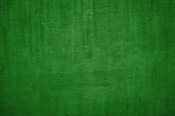 The texture of green natural Italian leather with a pile. Green background.