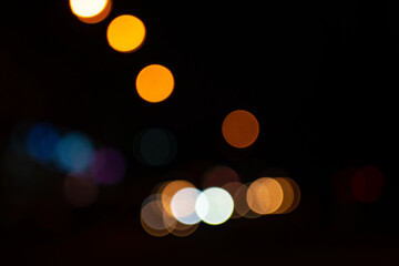 Bright round lights on black background