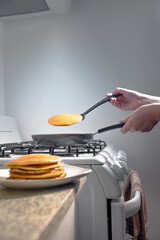 Taking the hotcakes out of the warm skillet