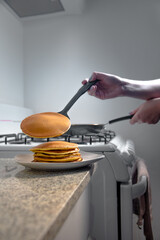 Woman cooking some delicious Hotcake