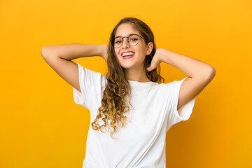 Young caucasian woman stretching arms, relaxed position.