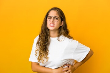 Young caucasian woman having a liver pain, stomach ache.