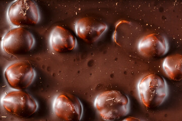 Chocolate background with nuts.Sweet food photo concept.Delicious dessert. Popular sweets.