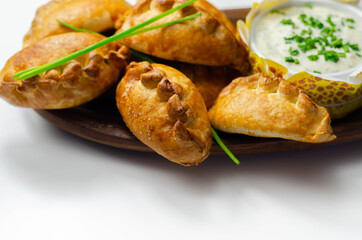 Mini pasties with sour cream, succulent pork, turkey, bacon and cranberry all wrapped in shortcrust pastry