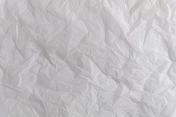 abstract background of crumpled white parchment texture close up
