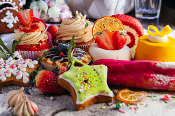 Variety of delicious confectionery products. A mix of chocolate mousse, eclair cakes, Cupcakes and...