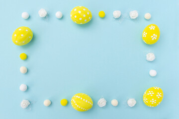 Easter eggs flat lay made of paper promotion in the store easter discounts place for text congratulation on a blue background yellow color stock