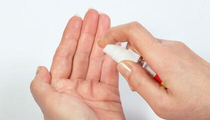 Antibacterial hand spray, hand sanitizer on white background
