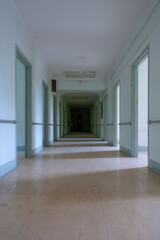 Obraz na płótnie Canvas Hallway inside an abandoned mental hospital
