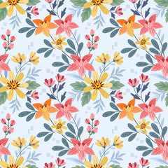 Fototapeta na wymiar Colorful flowers on a light blue color seamless pattern for fabric textile background and backdrop.