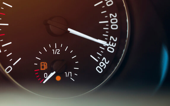 vehicle speed indicator showing excessive speed and low gas amount