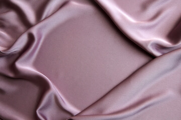 Fototapeta premium Beautiful smooth elegant wavy pink satin silk luxury fabric, fabric texture, abstract background design. Copy space